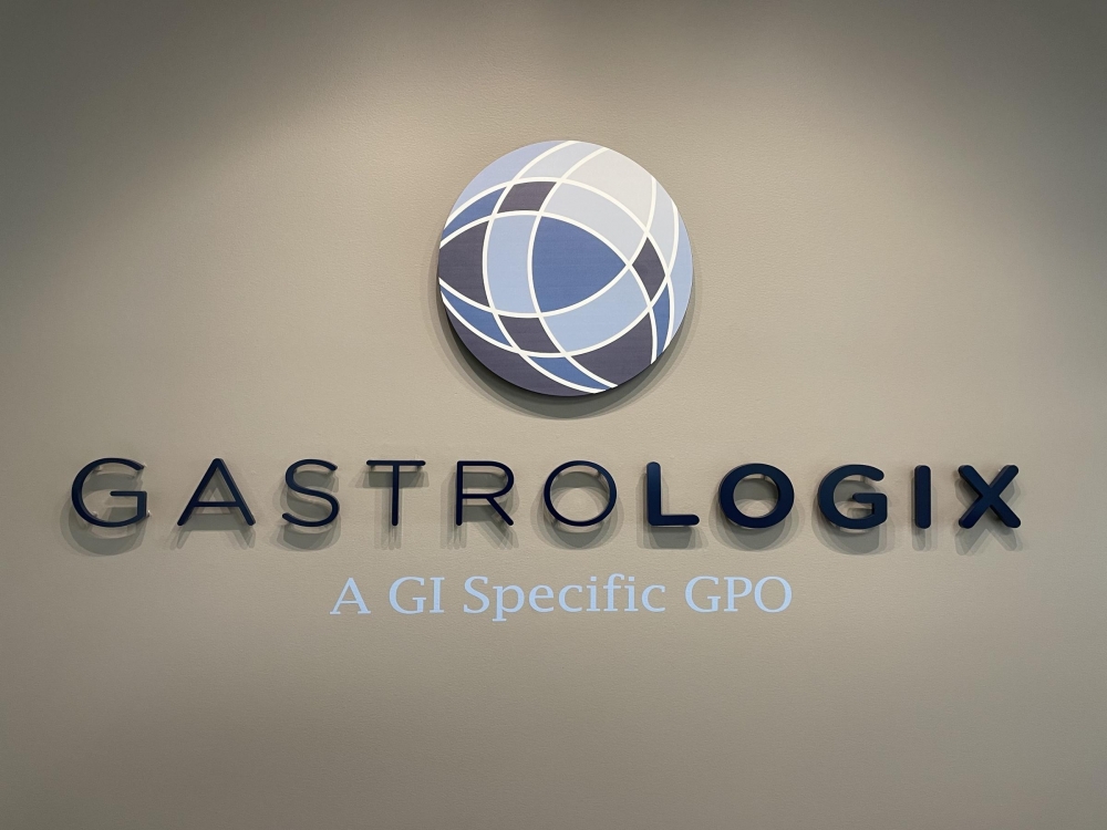 Gastrologix on Wall with Vinyl Lettered Tagline and Printed Circle Logo