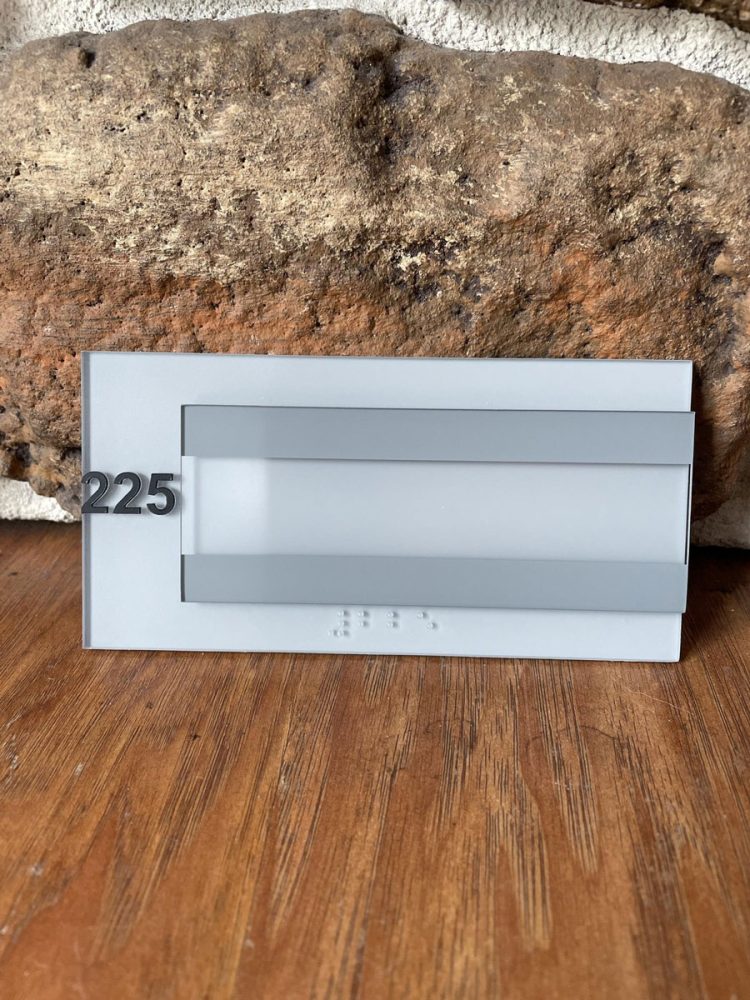 Architectural Room Number Sign with Window Insert Panel and Braille Closeup